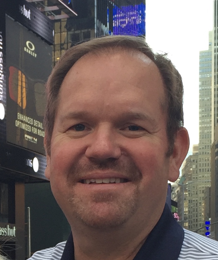 Dan Bertsche, reverse mortgage specialist, smiling in an outdoor portrait.